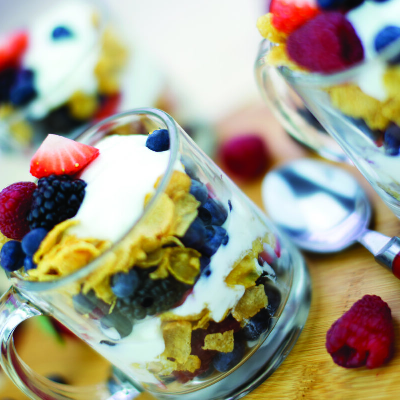 Mixed berry cereal yogurt crunch with layers of yogurt, fresh berries, and crunchy cereal.
