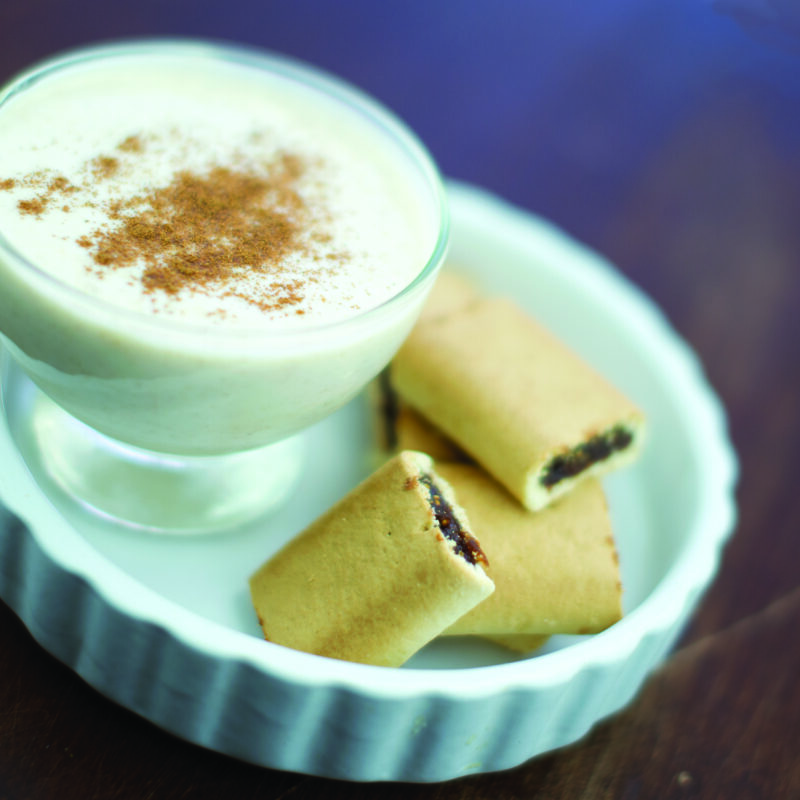 Gingerbread vanilla yogurt topped with fig cookies in a bowl.