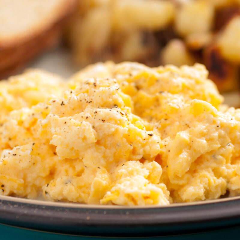 Scrambled eggs made with yogurt on a plate.